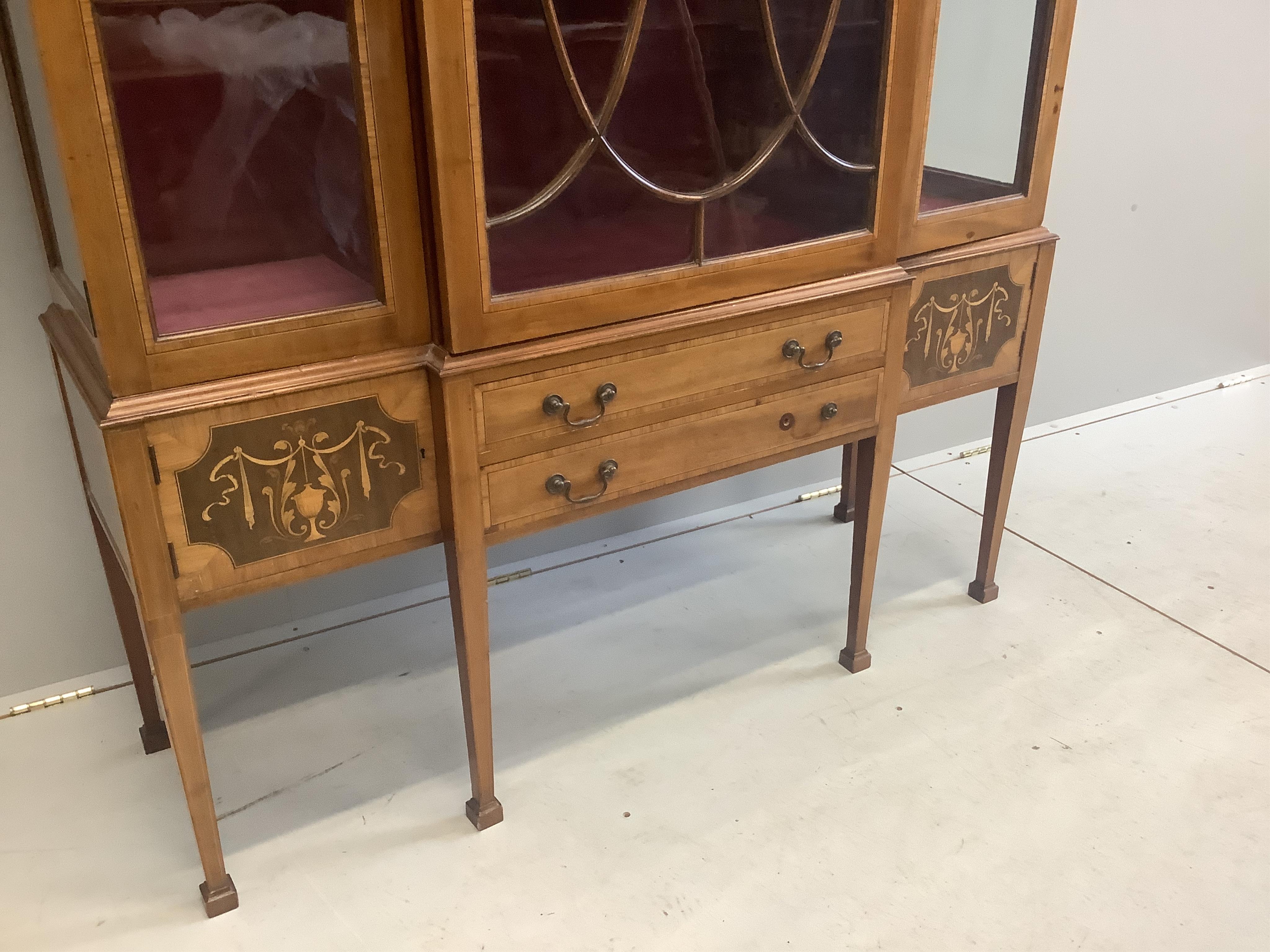 An Edwardian marquetry inlaid satinwood banded mahogany breakfront display cabinet, width 132cm, depth 42cm, height 186cm. Condition - fair